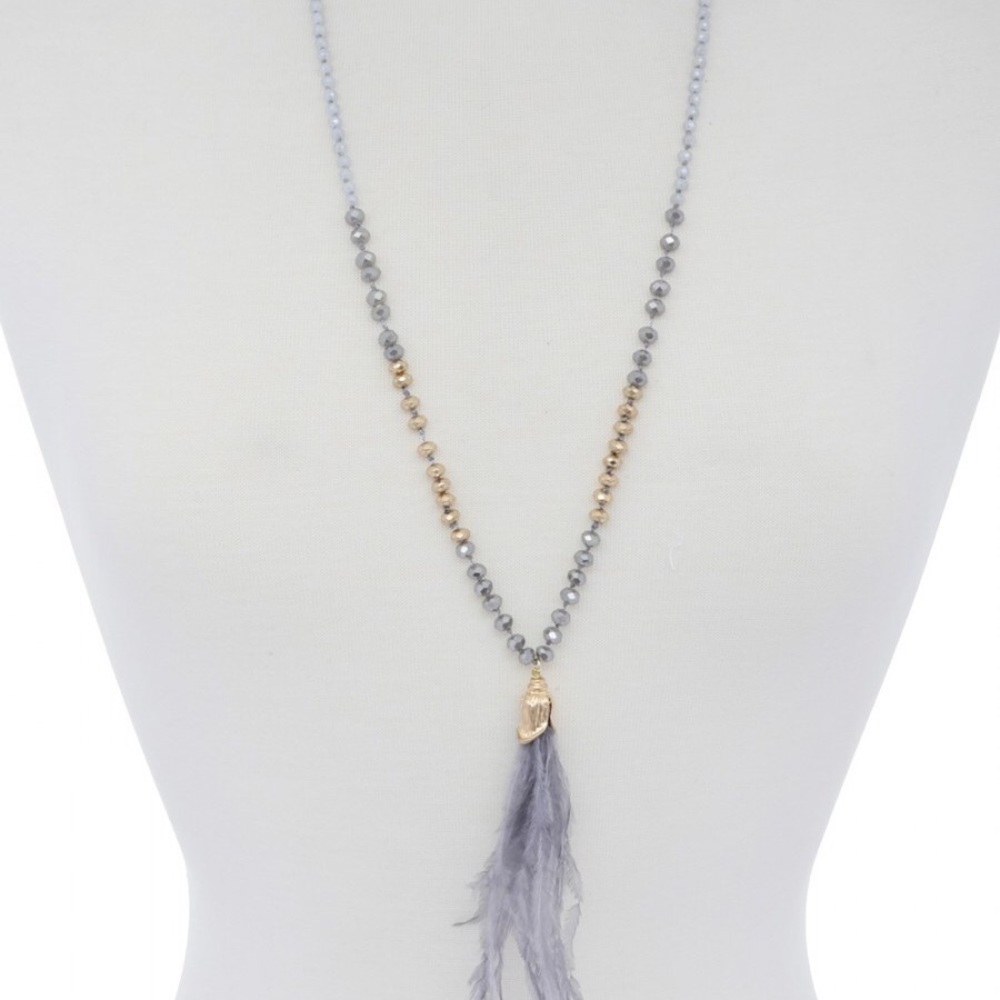 Long beaded necklace with feather